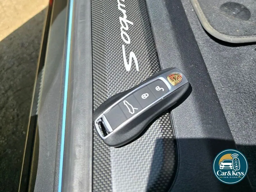 A Porsche Taycan key programmed at the car